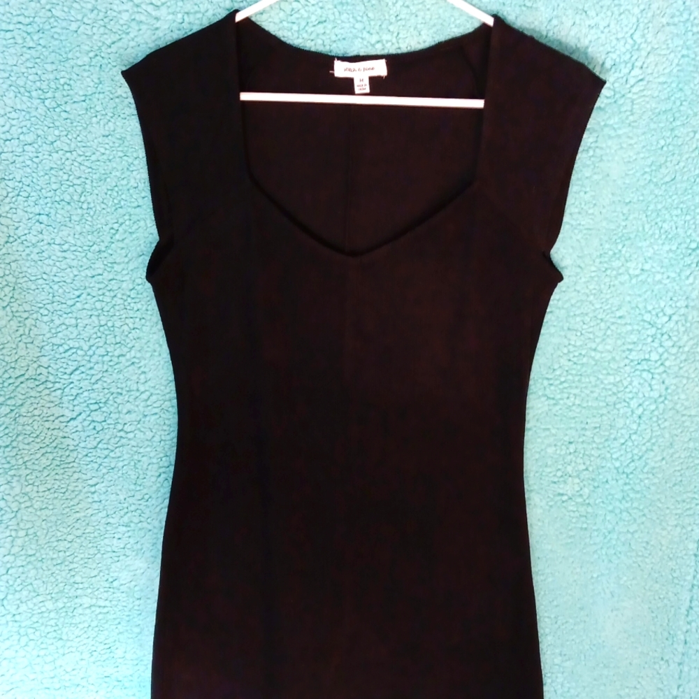 Long 45 inches from top back of neck to very bottom of dress,  low cut top front